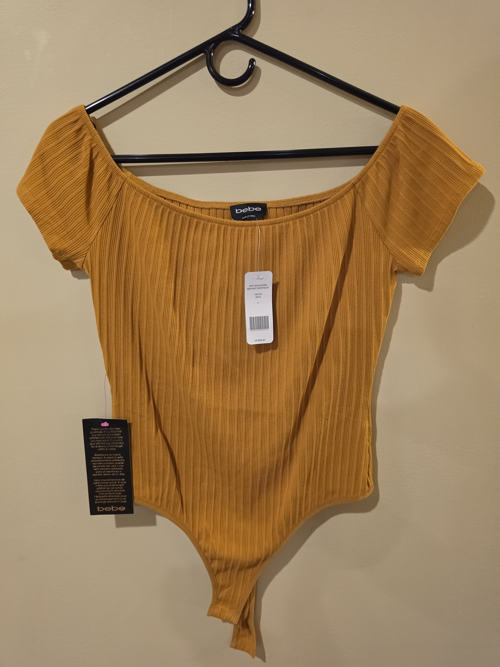 bebe Ribbed Off-Shoulder Bodysuit in Mustard